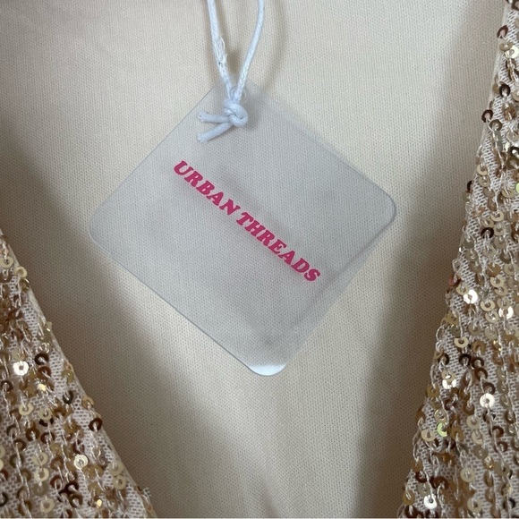 SEQUIN WRAP TIE FRONT MINI DRESS IN GOLD
Dress by Urban Threads - Picture 4 of 5